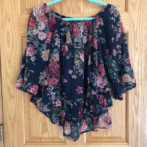 Off-the-shoulder floral, flowy and light blouse.